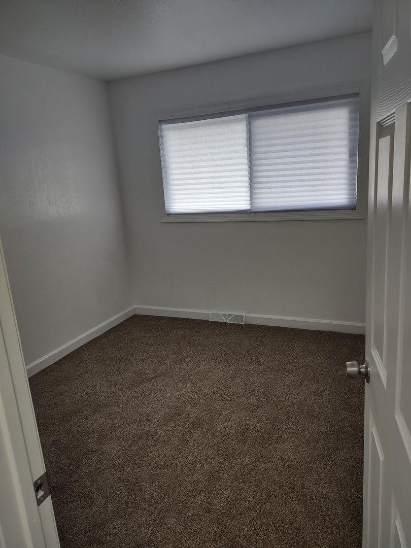 16549 California Avenue Markham, IL 60428 - Photo 7 of 14 an empty room with a window