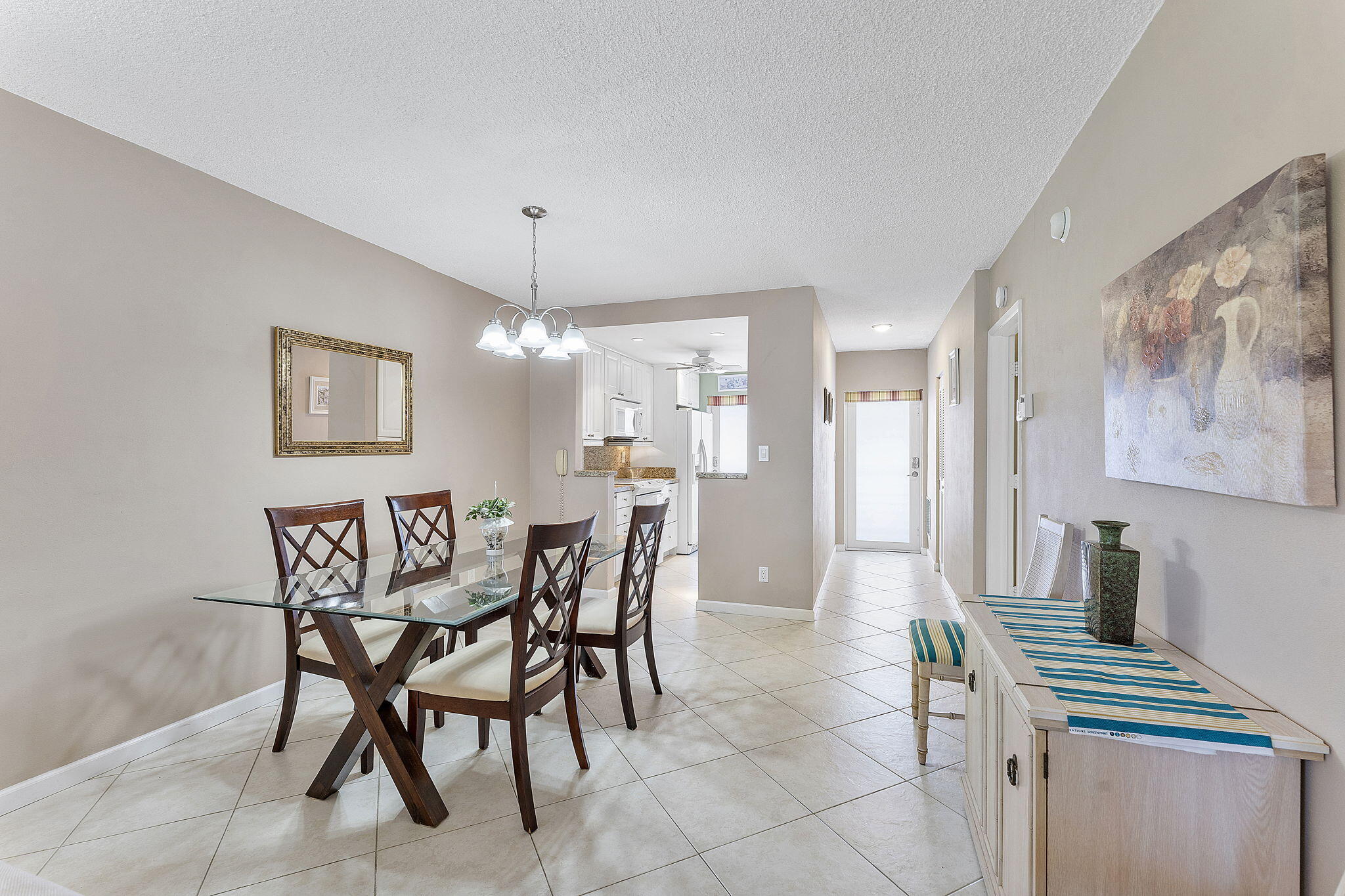 101 Northeast 19th Avenue, Unit 208 Deerfield Beach, FL 33441 - Photo 12 of 38 a view of a dining room with furniture