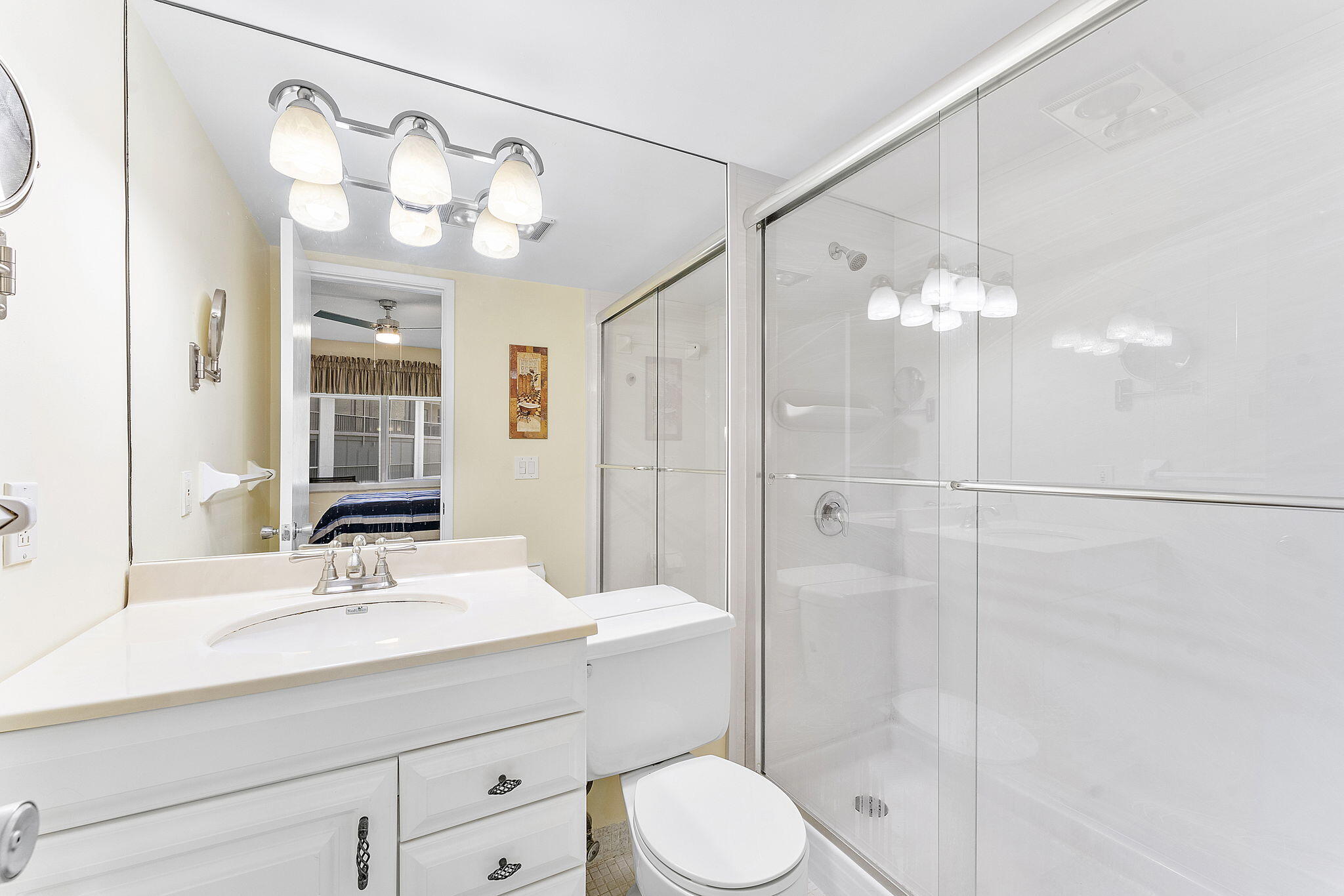 101 Northeast 19th Avenue, Unit 208 Deerfield Beach, FL 33441 - Photo 17 of 38 a bathroom with a sink a toilet and shower