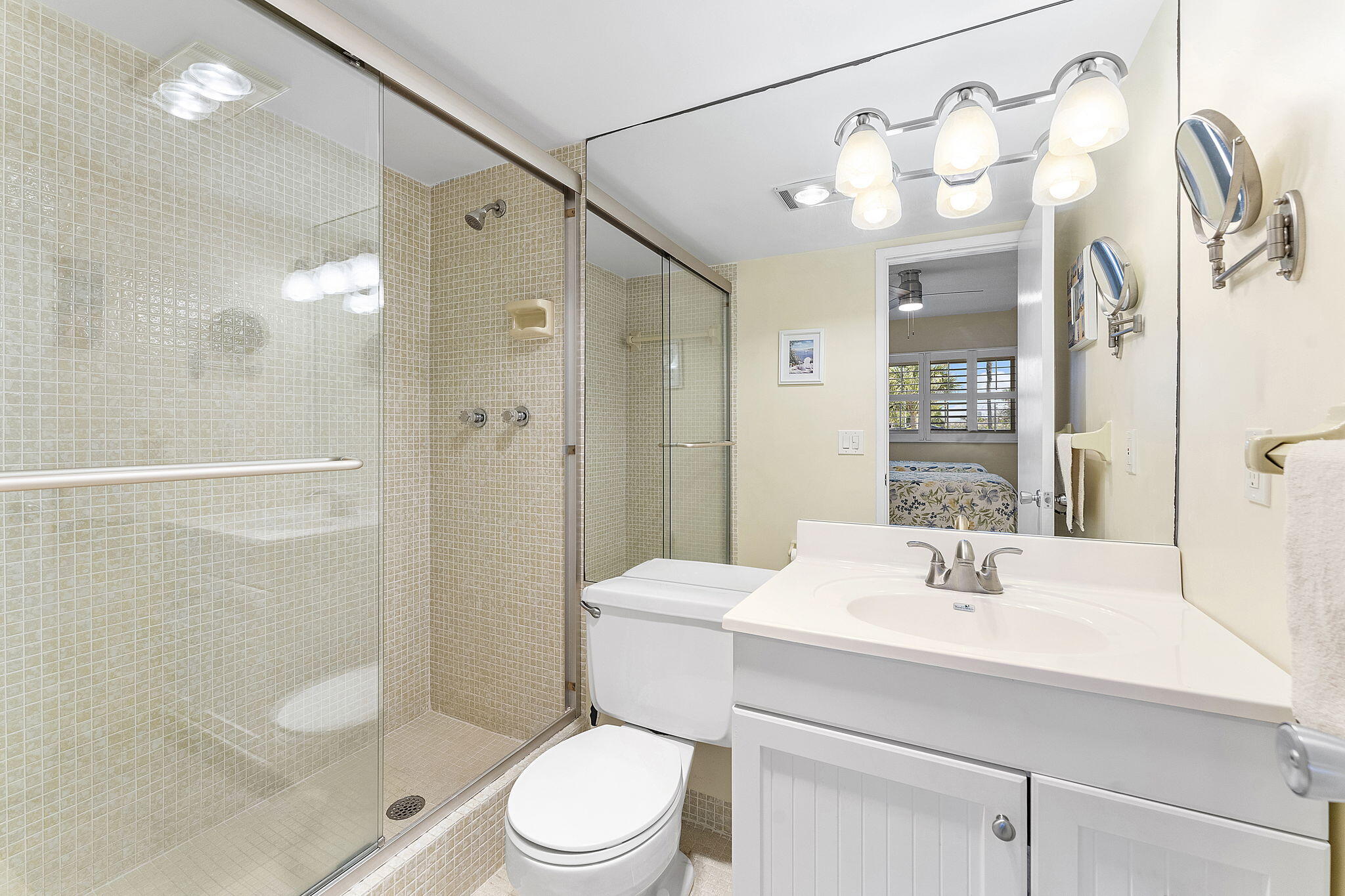 101 Northeast 19th Avenue, Unit 208 Deerfield Beach, FL 33441 - Photo 20 of 38 a bathroom with a sink a toilet and shower