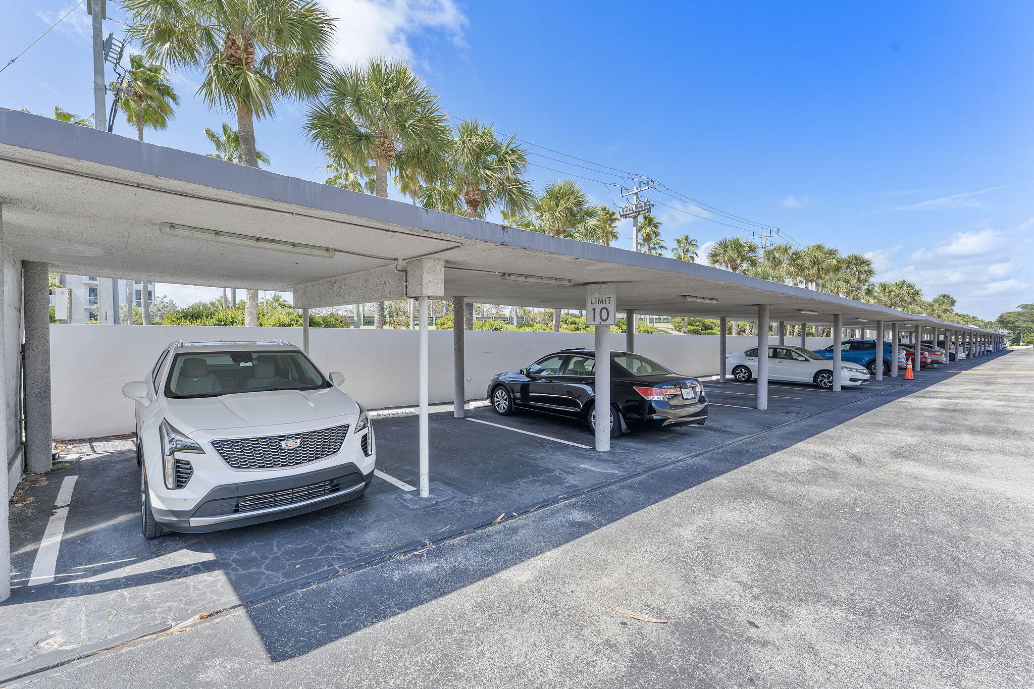 101 Northeast 19th Avenue, Unit 208 Deerfield Beach, FL 33441 - Photo 22 of 38 a view of a cars park in front of house