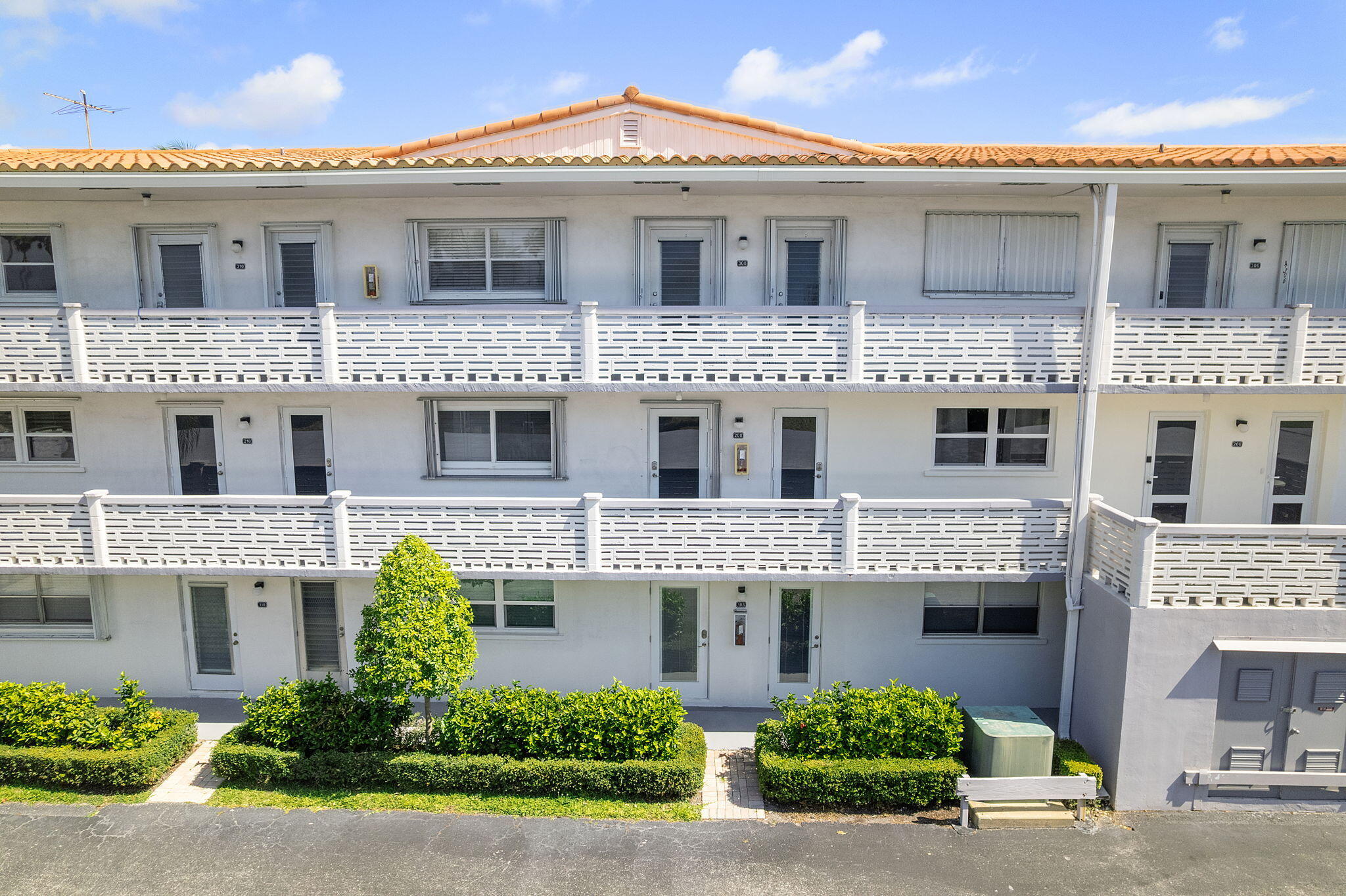 101 Northeast 19th Avenue, Unit 208 Deerfield Beach, FL 33441 - Photo 9 of 38 a front view of a residential houses