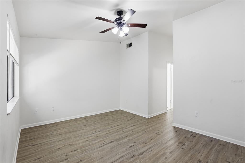 2219 Southwest 39th Way Gainesville, FL 32607 - Photo 10 of 17 a view of an empty room with wooden floor