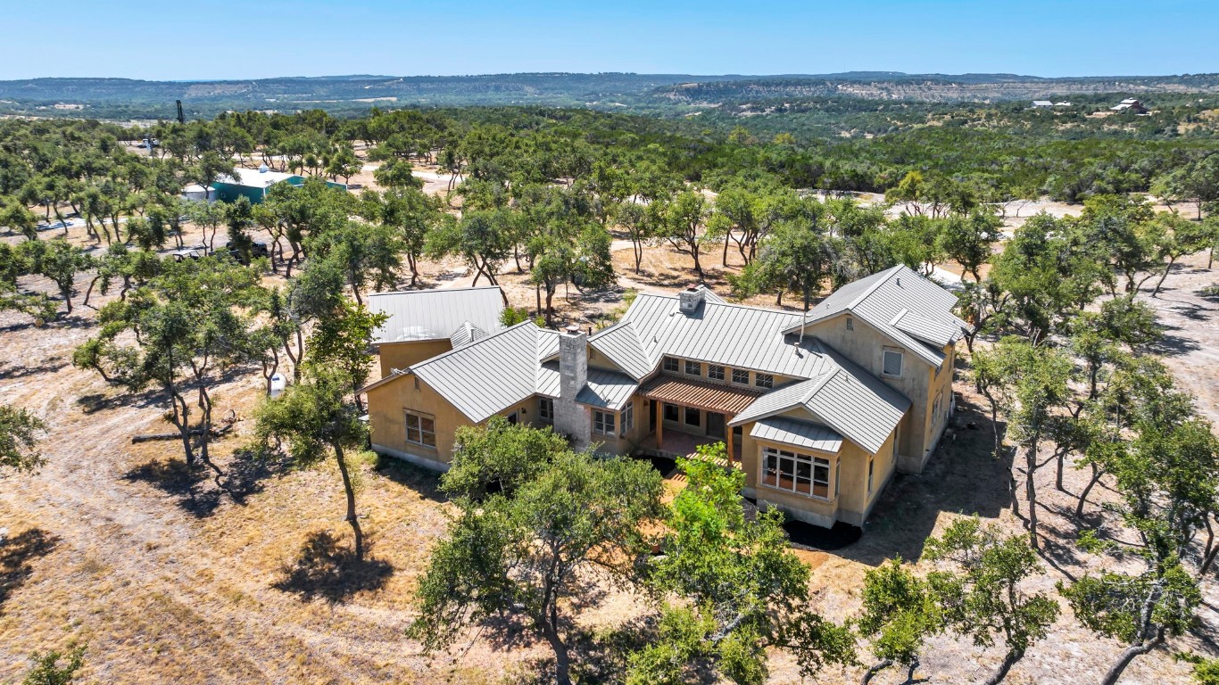 an aerial view of residential house with outdoor space