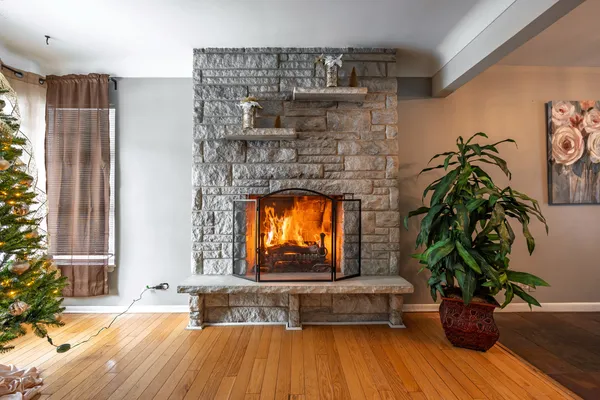 a living room with furniture and a fireplace