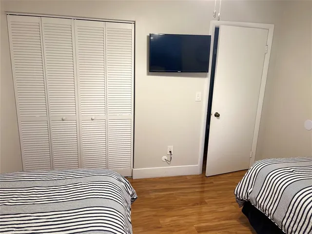 a bedroom with a bed and a shower