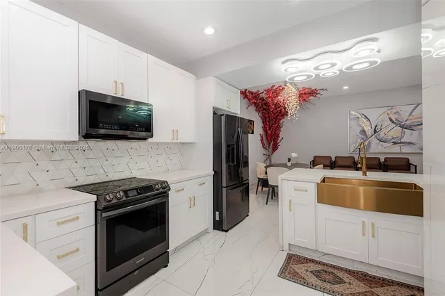 a kitchen with a stove and a microwave