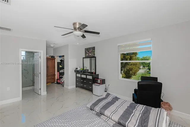 a bedroom with a bed and a couch