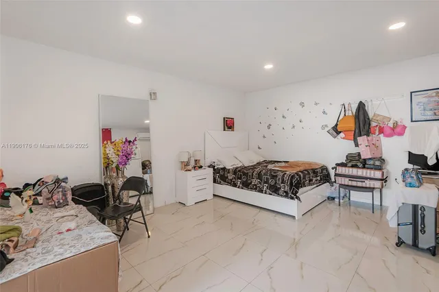 a bedroom with furniture and a couch