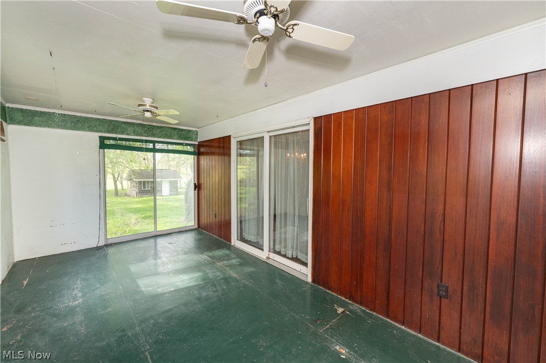 12310 Huntoon Road Painesville, OH 44077 - Photo 28 of 48 Large, comfortable 3-season room with slider from the dining room, walkout to the backyard and electricity