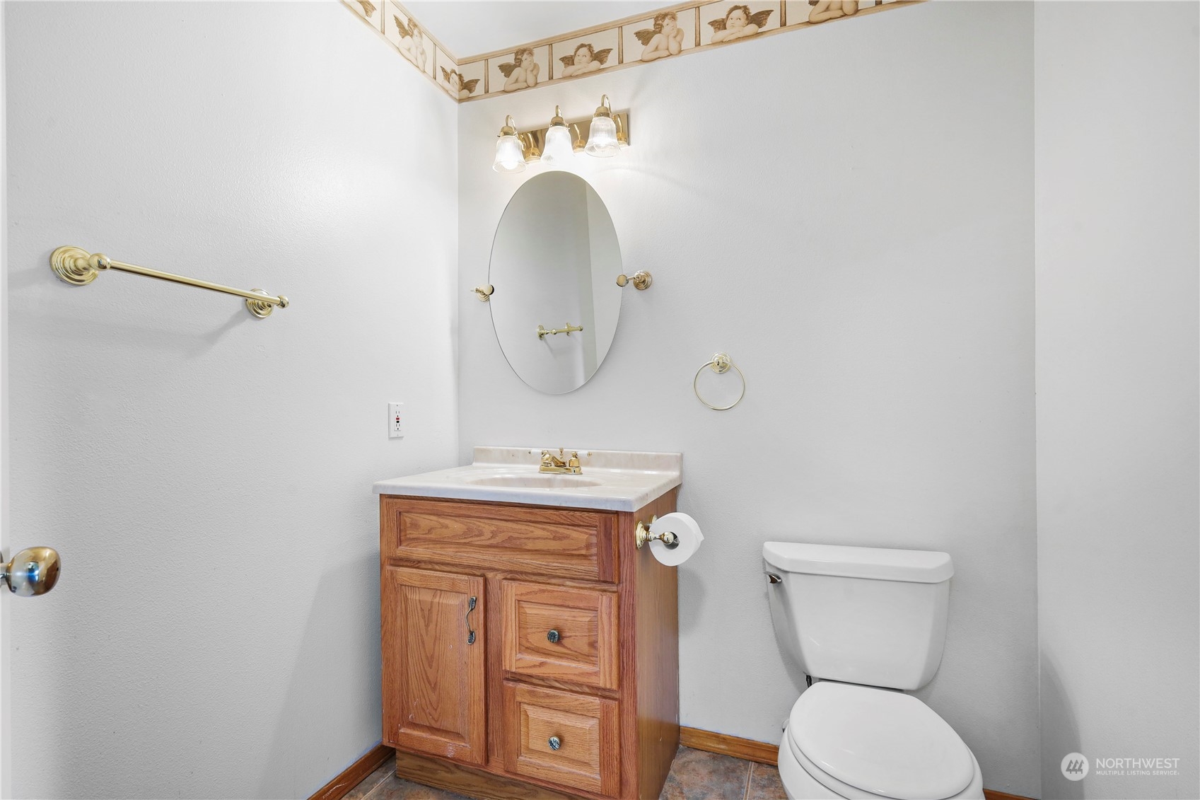3116 289th Street South Roy, WA 98580 - Photo 16 of 38 a bathroom with a toilet sink and mirror