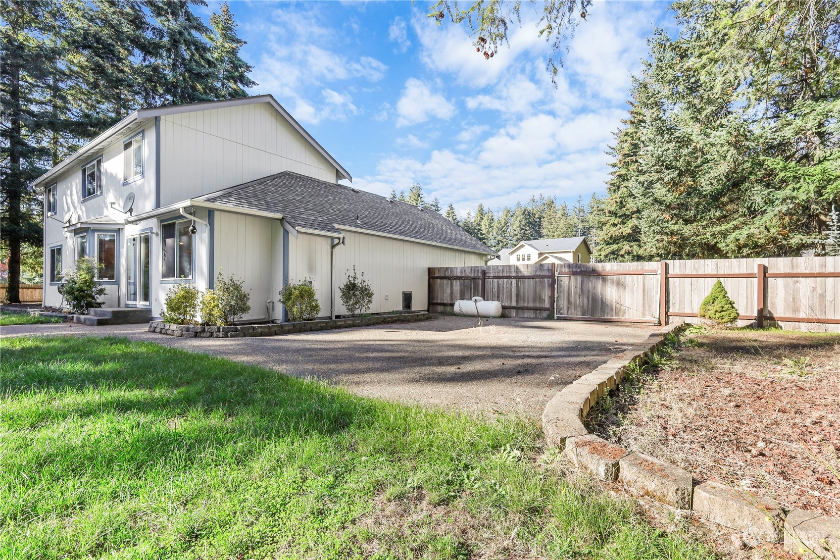 3116 289th Street South Roy, WA 98580 - Photo 26 of 38 a view of a house with a yard