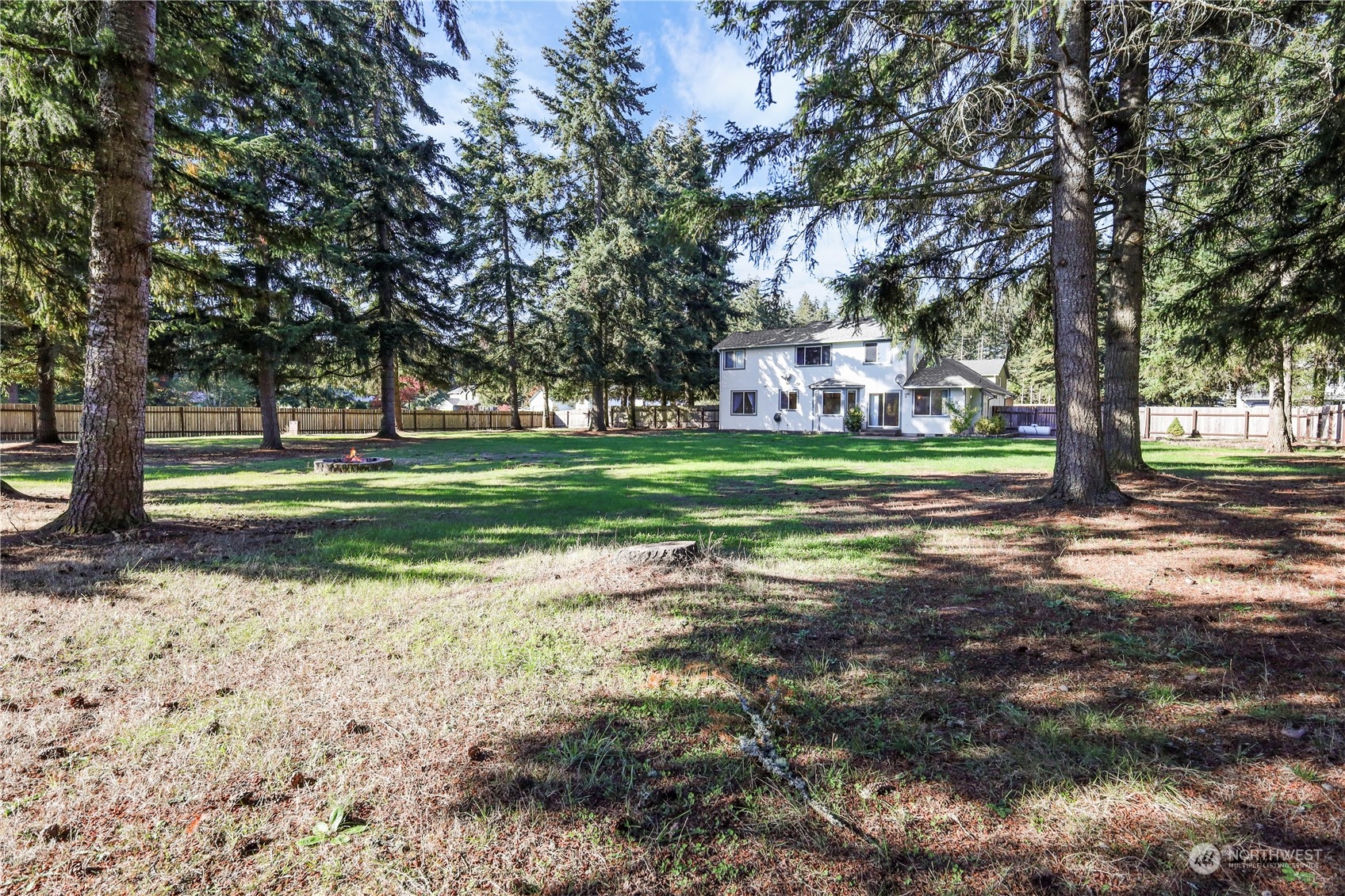 3116 289th Street South Roy, WA 98580 - Photo 30 of 38 a backyard of a house with lots of green space