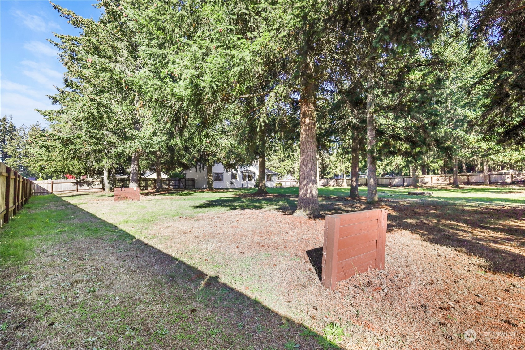 3116 289th Street South Roy, WA 98580 - Photo 32 of 38 a wooden bench sitting in the middle of a yard