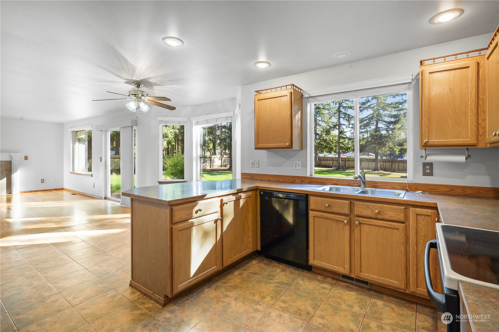 3116 289th Street South Roy, WA 98580 - Photo 8 of 38 a kitchen with stainless steel appliances granite countertop a stove and a sink