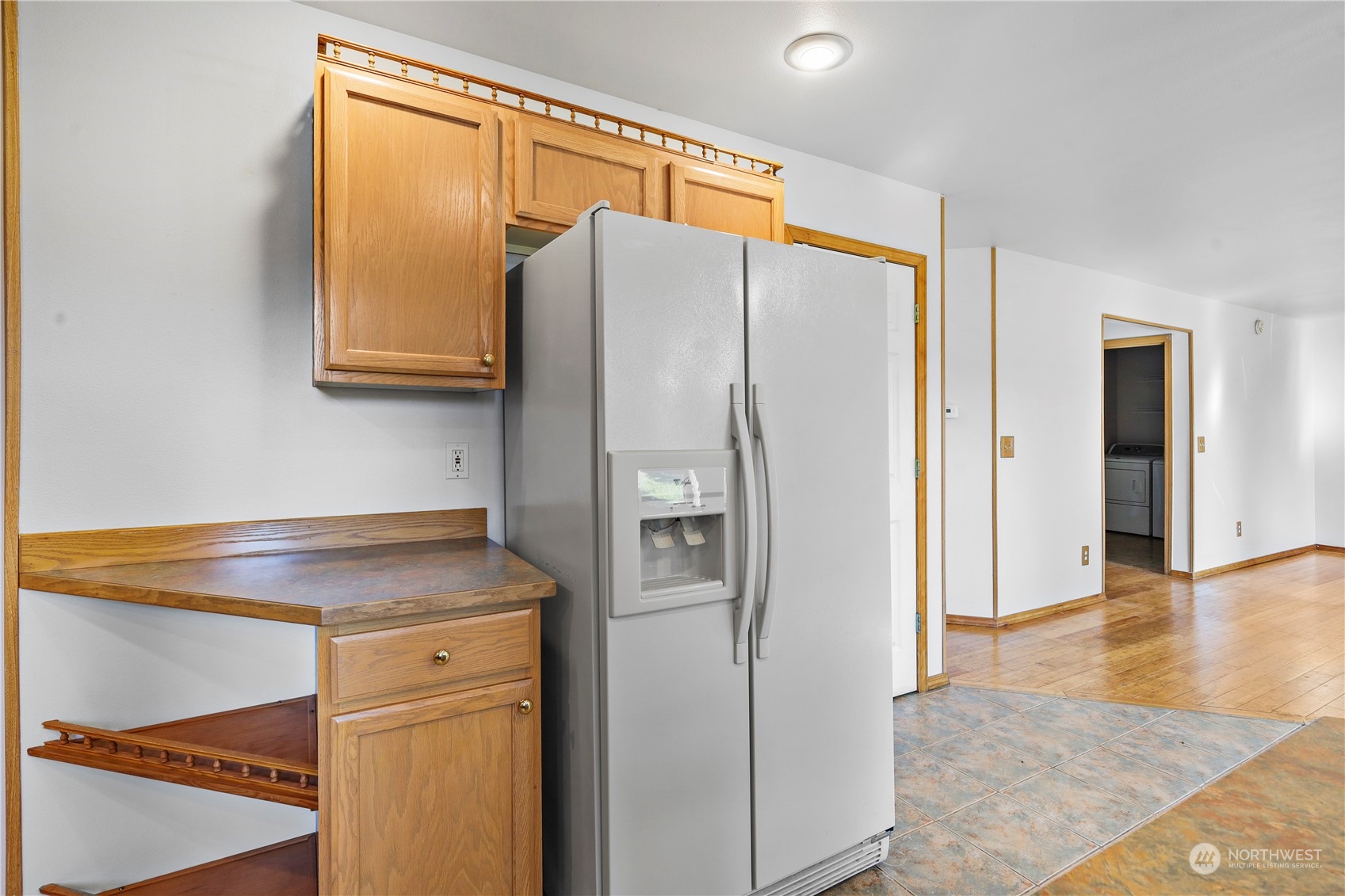 3116 289th Street South Roy, WA 98580 - Photo 9 of 38 a kitchen with stainless steel appliances granite countertop a refrigerator and a sink