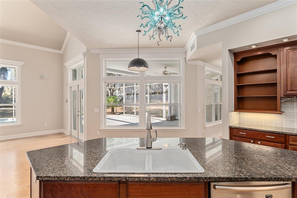 10614 Southwest 15th Lane Gainesville, FL 32607 - Photo 23 of 85 a kitchen with granite countertop a stove and a granite counter tops
