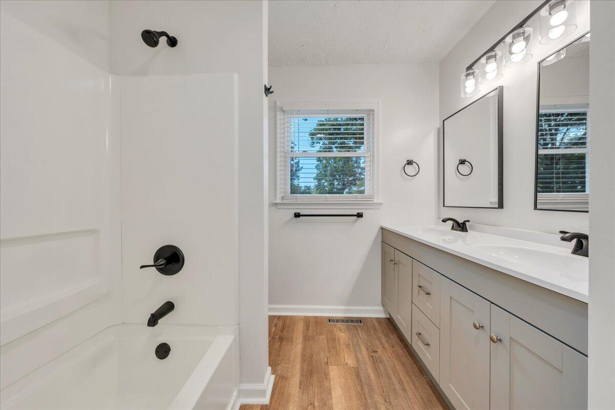 427 Farmington Road Hardy, VA 24101 - Photo 11 of 56 a bathroom with a tub sink shower and mirror