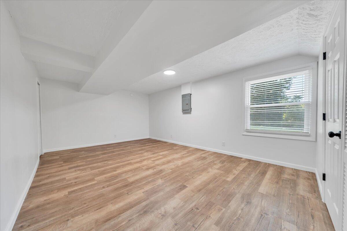 427 Farmington Road Hardy, VA 24101 - Photo 30 of 56 a view of an empty room with wooden floor and a window