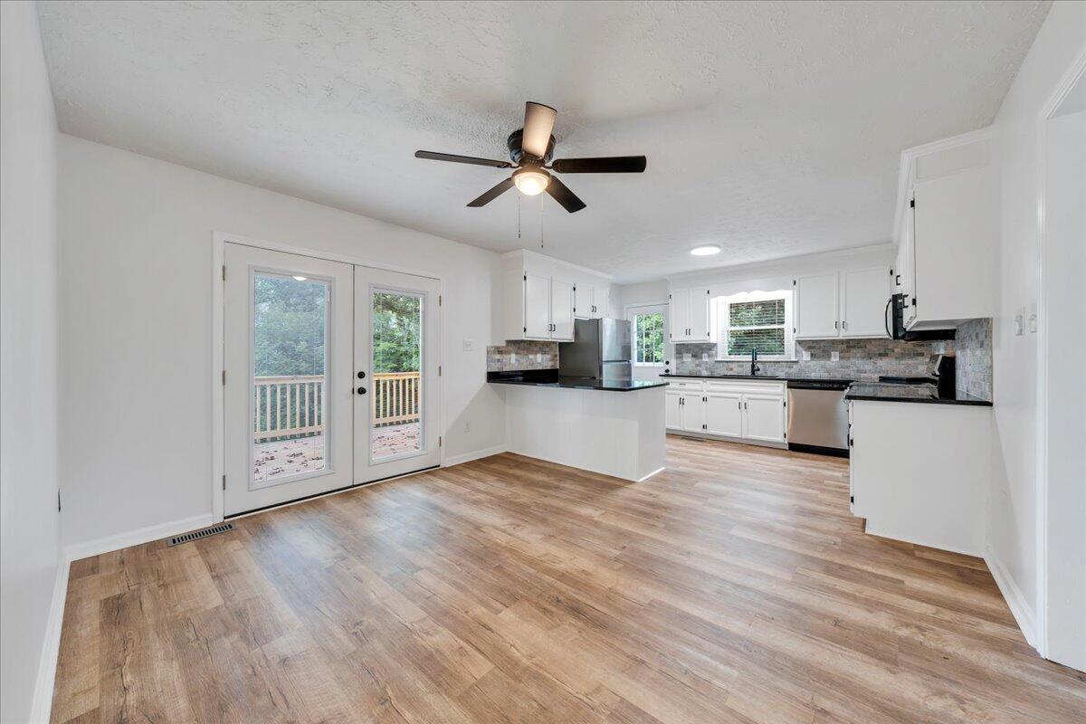 427 Farmington Road Hardy, VA 24101 - Photo 5 of 56 a view of a kitchen with wooden floor and a kitchen