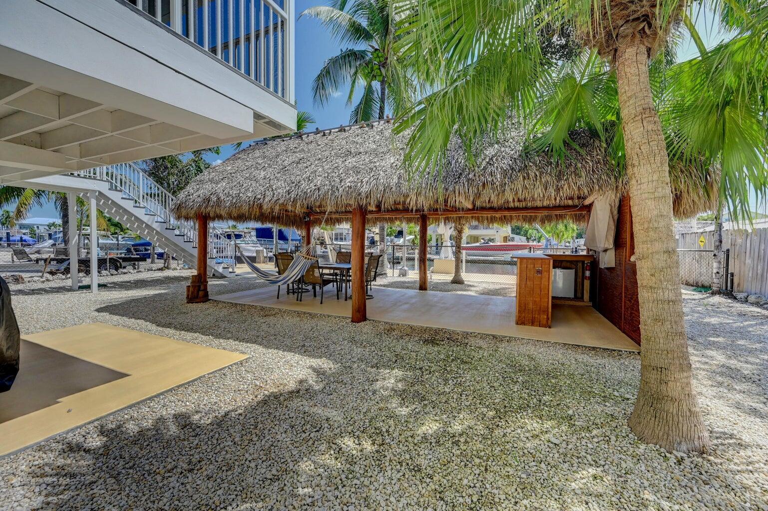 239 Lower Matecumbe Road, Unit 239 Key Largo, FL 33037 - Photo 12 of 69 a view of outdoor space with porch and entertaining space