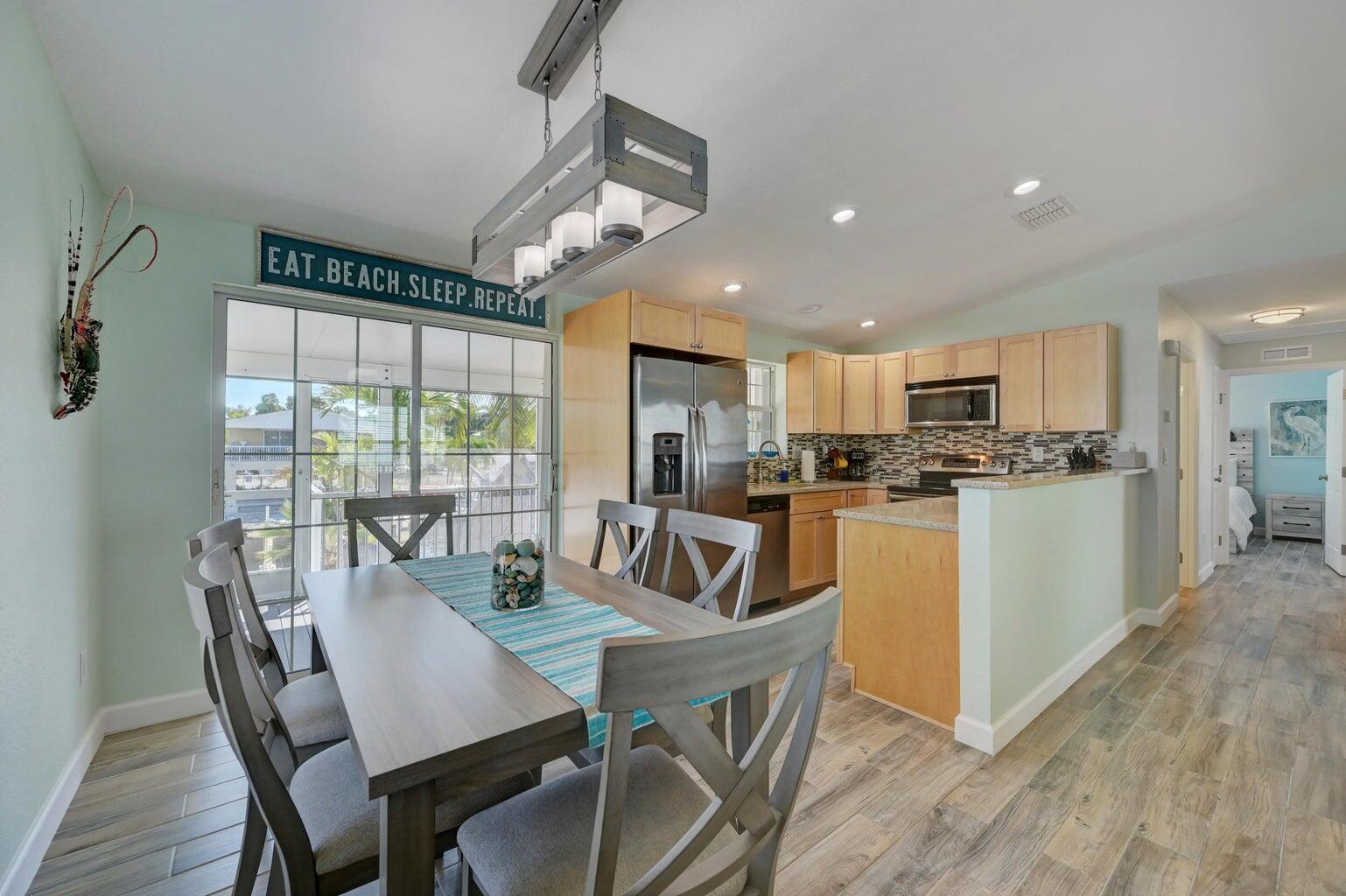 239 Lower Matecumbe Road, Unit 239 Key Largo, FL 33037 - Photo 21 of 69 a view of a dining room with furniture window and outside view