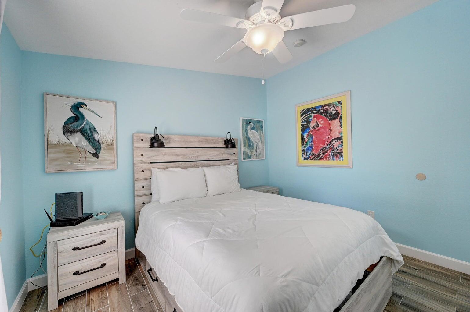 239 Lower Matecumbe Road, Unit 239 Key Largo, FL 33037 - Photo 35 of 69 a bedroom with a bed and a chandelier
