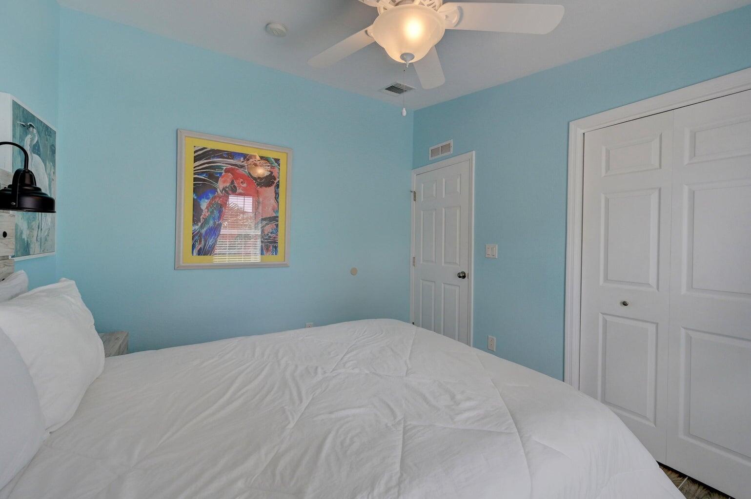 239 Lower Matecumbe Road, Unit 239 Key Largo, FL 33037 - Photo 37 of 69 a bedroom with a bed and a chandelier