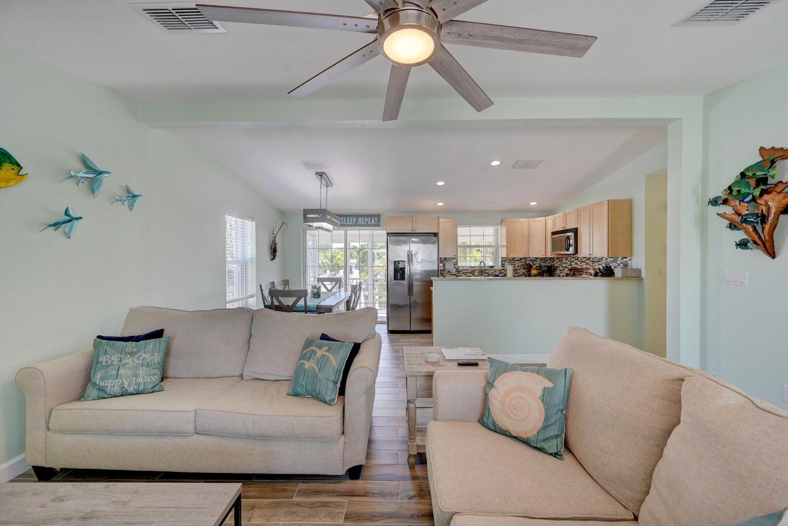 239 Lower Matecumbe Road, Unit 239 Key Largo, FL 33037 - Photo 4 of 69 a living room with furniture and kitchen view