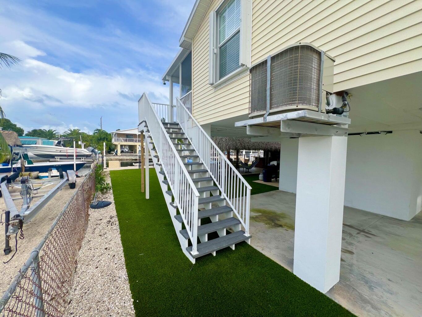 239 Lower Matecumbe Road, Unit 239 Key Largo, FL 33037 - Photo 44 of 69 a view of a house with a yard