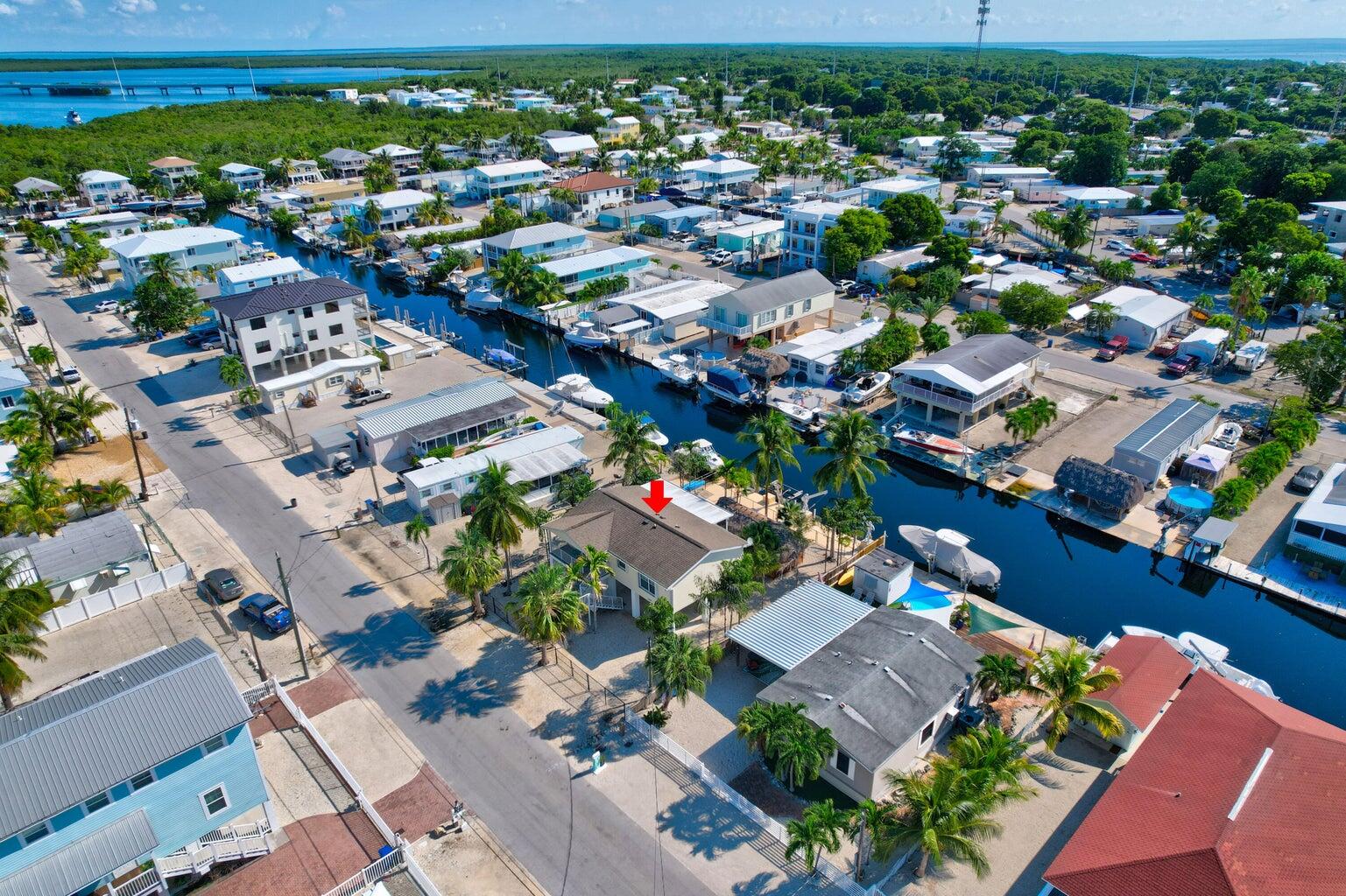 239 Lower Matecumbe Road, Unit 239 Key Largo, FL 33037 - Photo 61 of 69 an aerial view of a city with lots of residential buildings ocean and mountain view in back