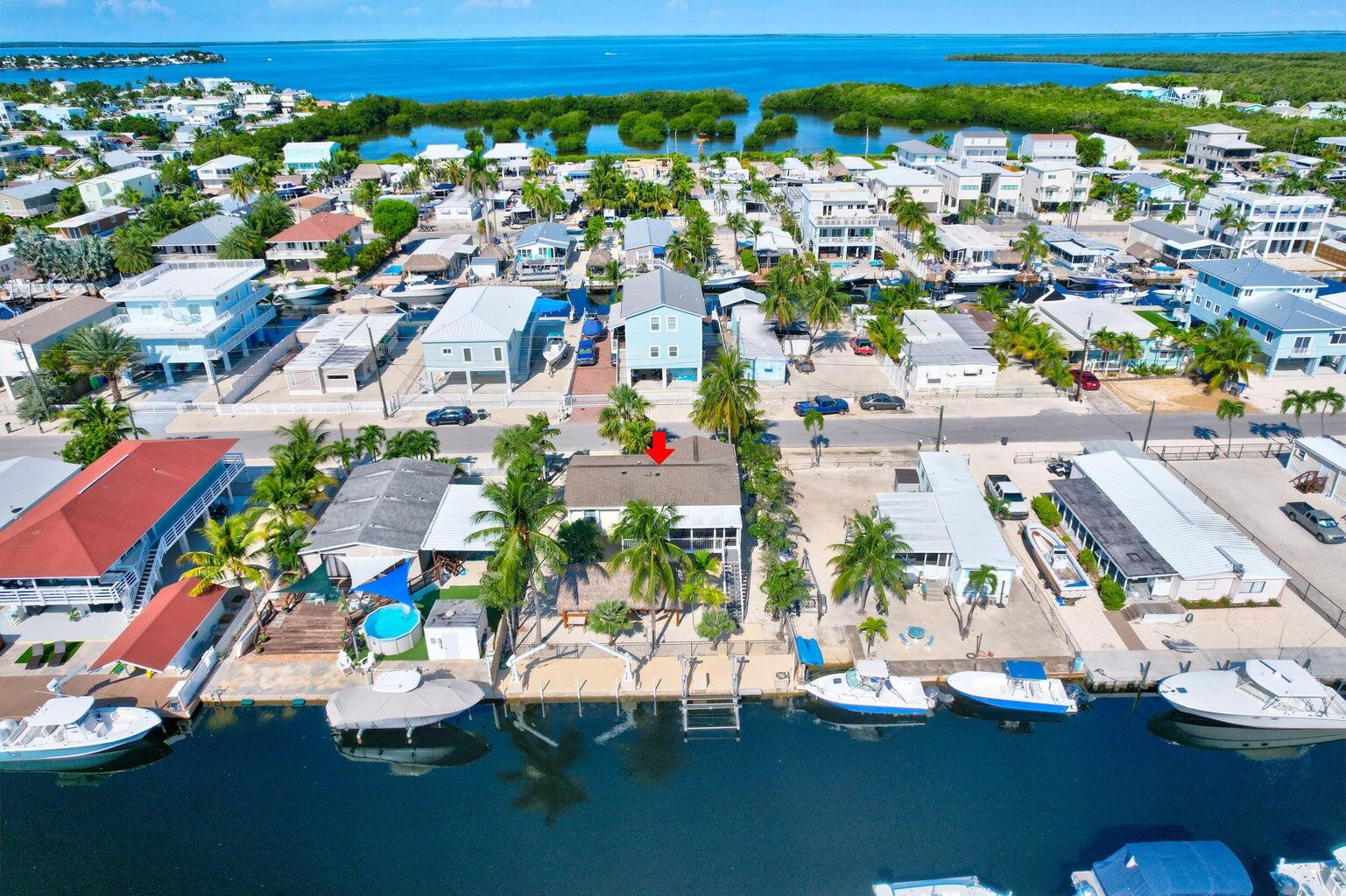 239 Lower Matecumbe Road, Unit 239 Key Largo, FL 33037 - Photo 64 of 69 an aerial view of residential houses with outdoor space and parking