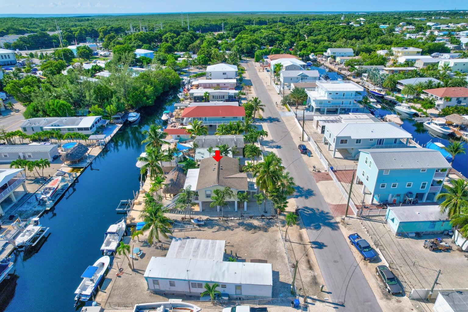 239 Lower Matecumbe Road, Unit 239 Key Largo, FL 33037 - Photo 66 of 69 an aerial view of residential houses with outdoor space and street view