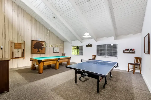 a outdoor space with a table and chairs