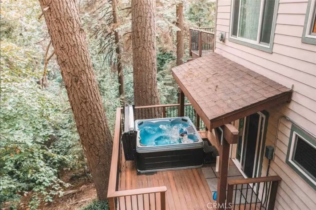 a view of balcony with furniture and wooden deck
