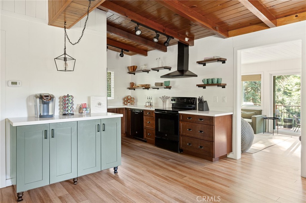 576 Kuffel Canyon Road Lake Arrowhead, CA 92352 - Photo 13 of 61 a kitchen with stainless steel appliances granite countertop a sink and cabinets