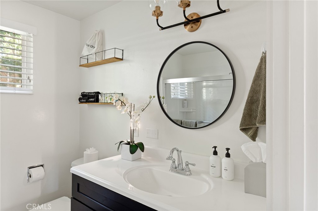 576 Kuffel Canyon Road Lake Arrowhead, CA 92352 - Photo 18 of 61 a bathroom with a sink and a mirror