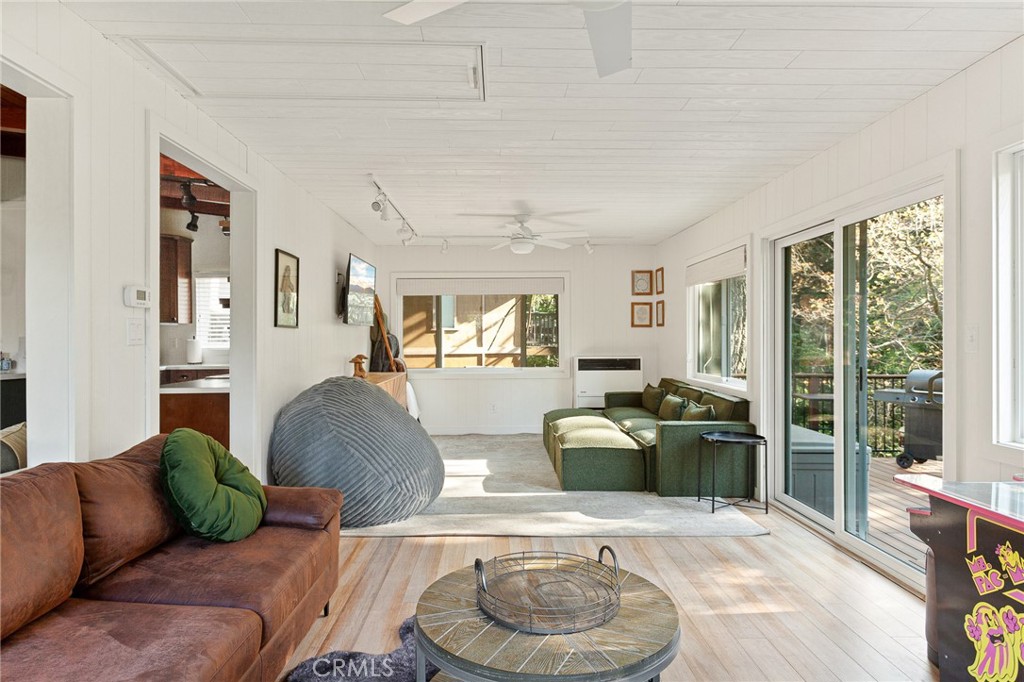 576 Kuffel Canyon Road Lake Arrowhead, CA 92352 - Photo 25 of 61 a living room with furniture and a large window
