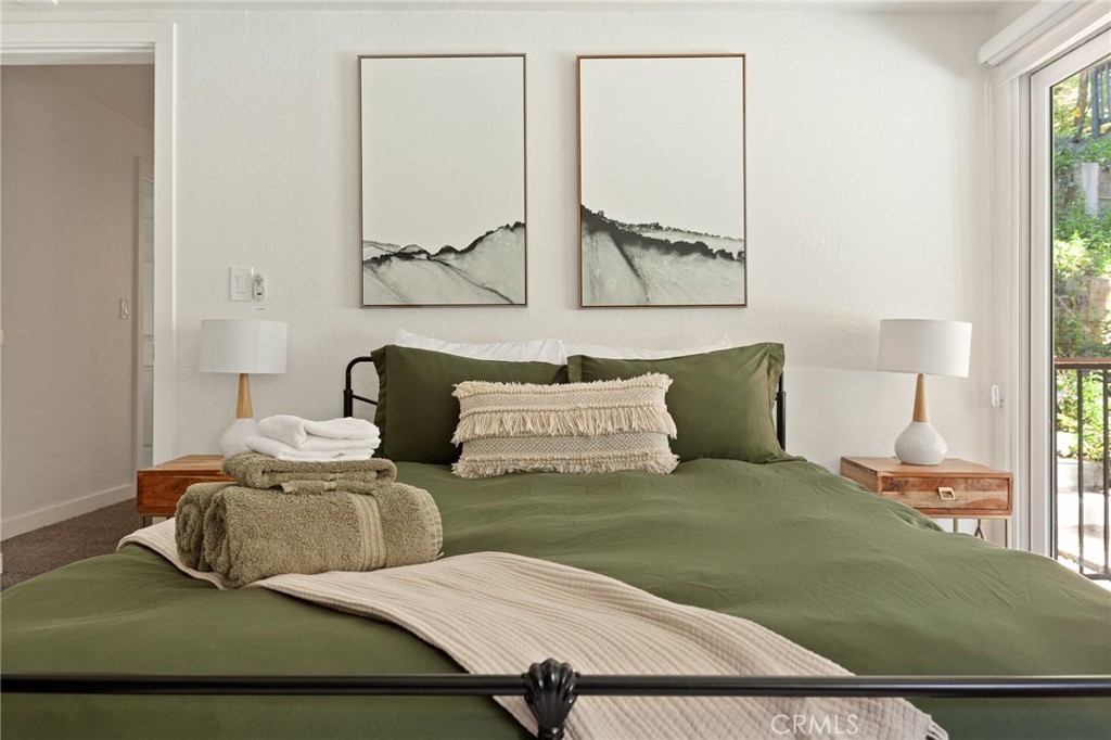 576 Kuffel Canyon Road Lake Arrowhead, CA 92352 - Photo 41 of 61 a bedroom with a bed and window