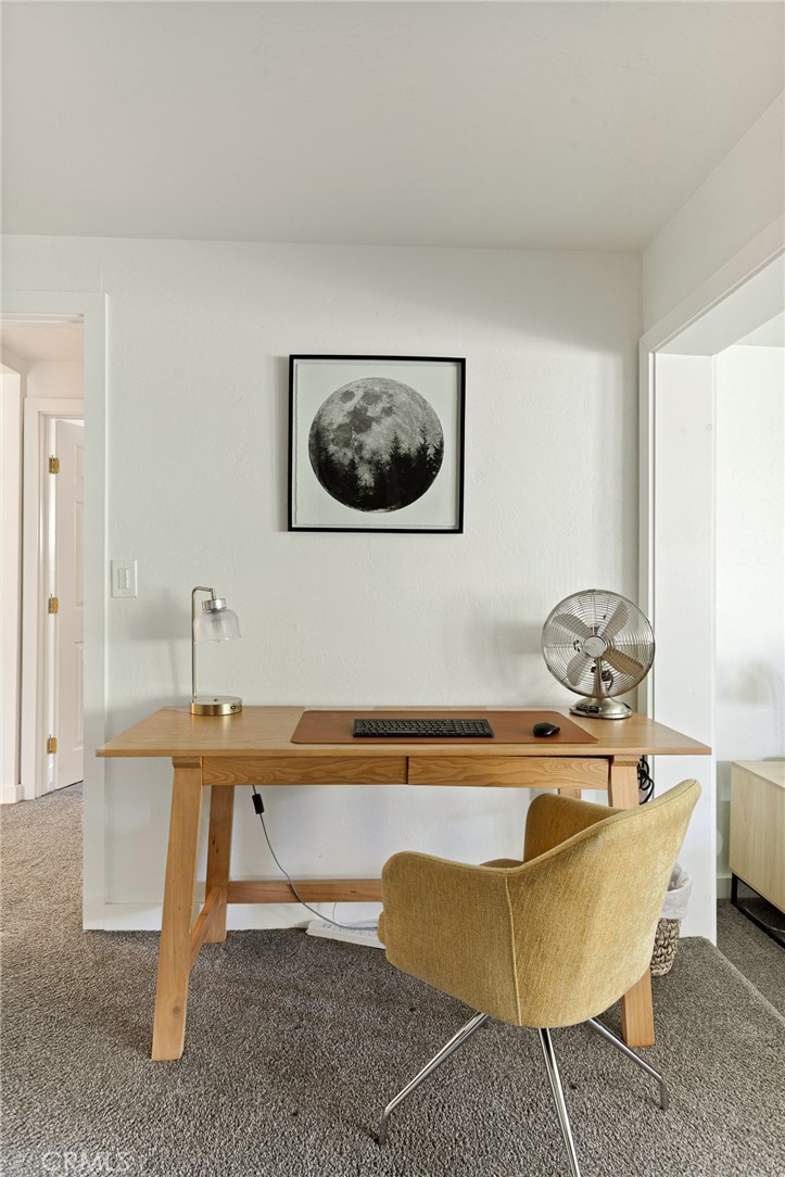 576 Kuffel Canyon Road Lake Arrowhead, CA 92352 - Photo 46 of 61 a living room with a couch and a table