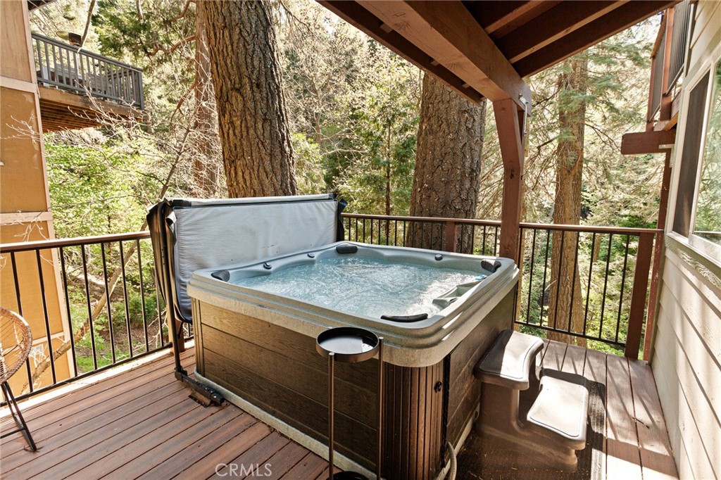 576 Kuffel Canyon Road Lake Arrowhead, CA 92352 - Photo 51 of 61 a view of balcony with furniture and wooden floor