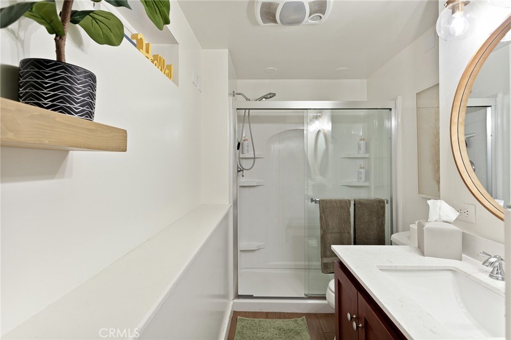 576 Kuffel Canyon Road Lake Arrowhead, CA 92352 - Photo 56 of 61 a bathroom with a sink a mirror and a shower