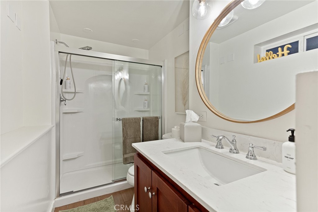 576 Kuffel Canyon Road Lake Arrowhead, CA 92352 - Photo 57 of 61 a bathroom with a sink a mirror and a shower