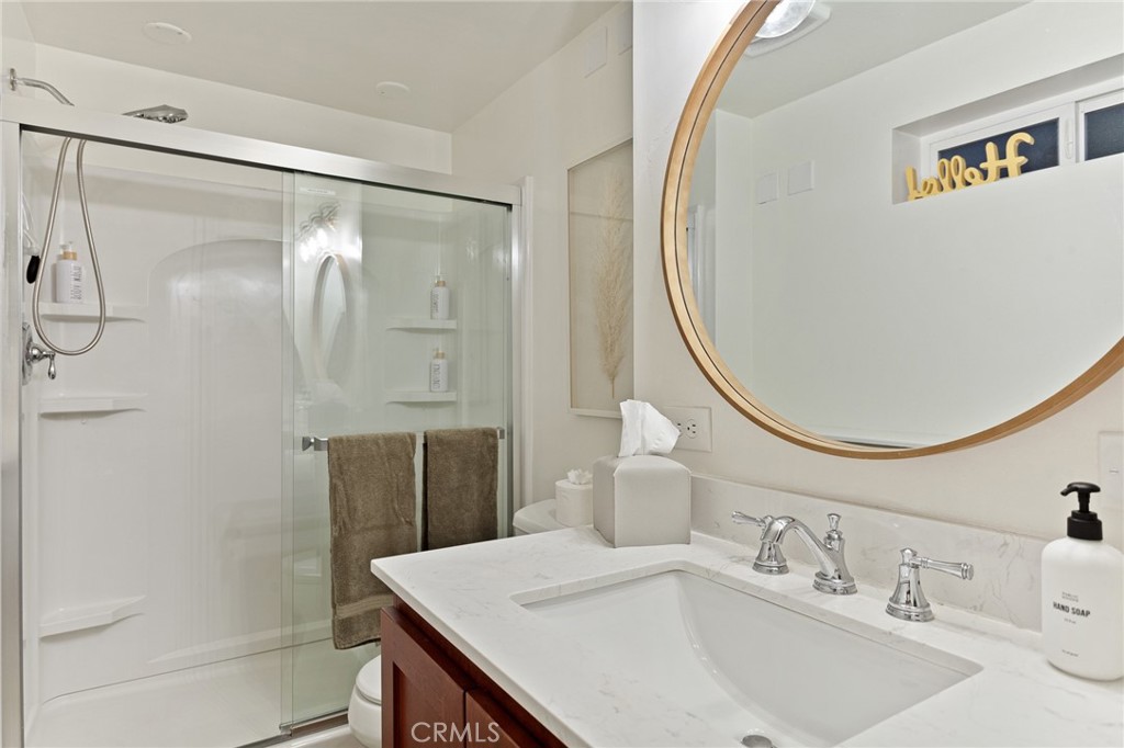 576 Kuffel Canyon Road Lake Arrowhead, CA 92352 - Photo 58 of 61 a bathroom with a sink and a mirror