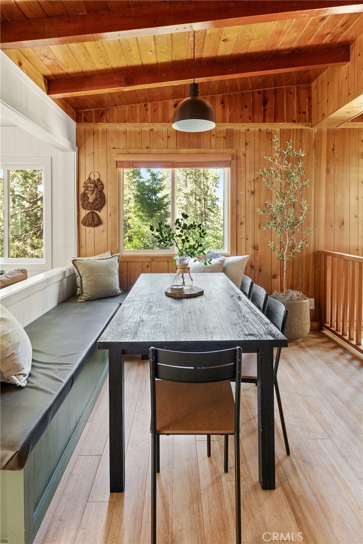 576 Kuffel Canyon Road Lake Arrowhead, CA 92352 - Photo 9 of 61 a view of a dining room with furniture window and outside view