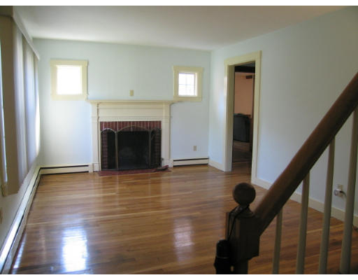 16 Booth Hill Road Scituate, MA 02066 - Photo 3 of 18 a view of an empty room with wooden floor and a window