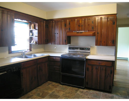 16 Booth Hill Road Scituate, MA 02066 - Photo 5 of 18 a kitchen with a sink and a stove