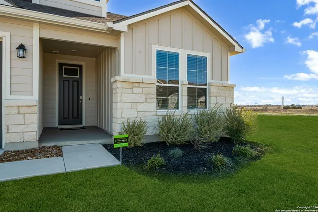a view of a back yard of the house