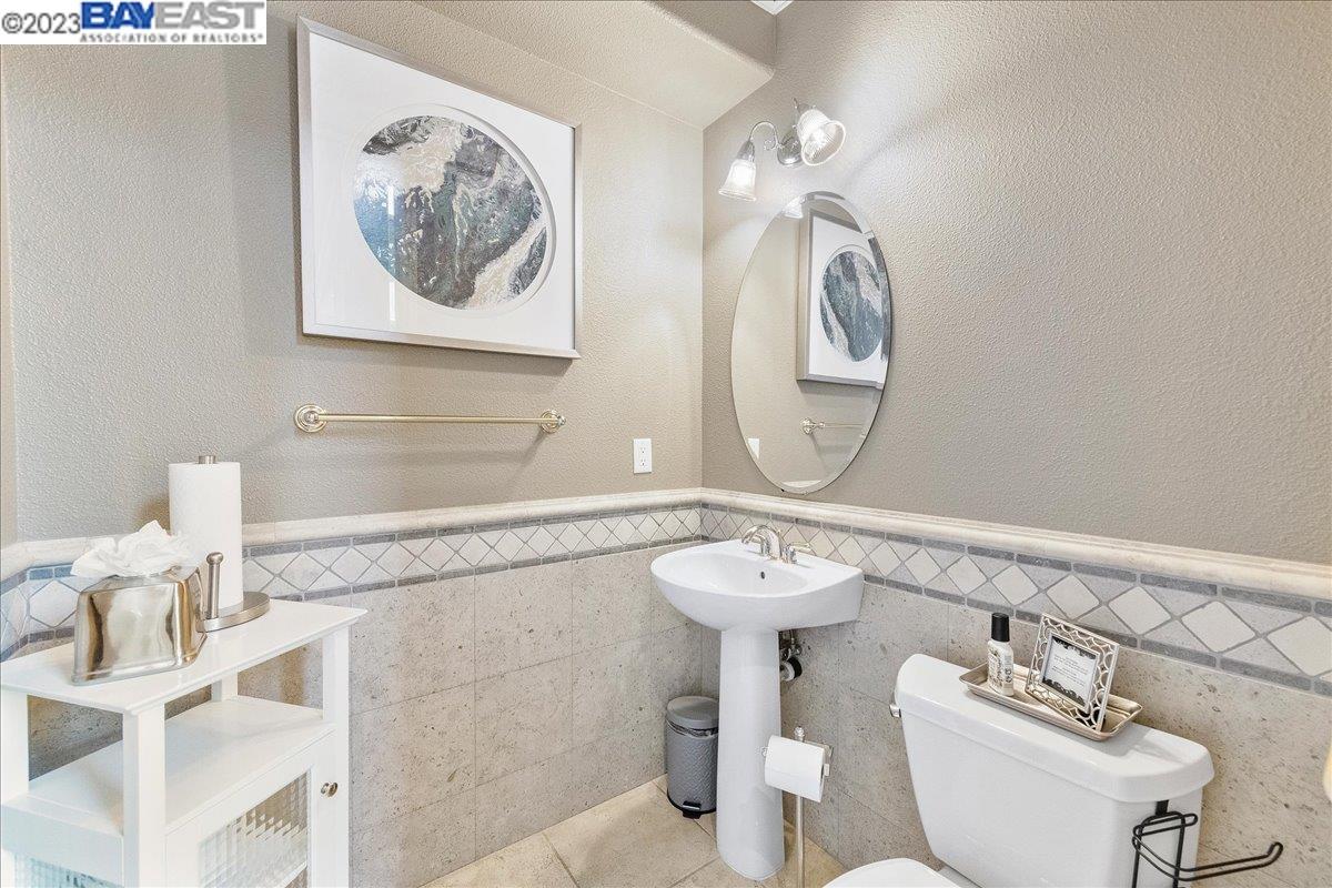 Undisclosed Address San Ramon, CA 94583 - Photo 18 of 57 a bathroom with a toilet sink and mirror