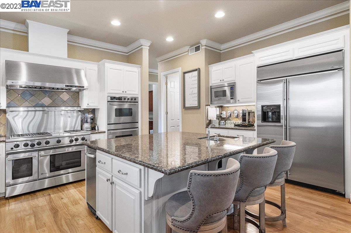 Undisclosed Address San Ramon, CA 94583 - Photo 24 of 57 a kitchen with stainless steel appliances granite countertop a sink stove and refrigerator
